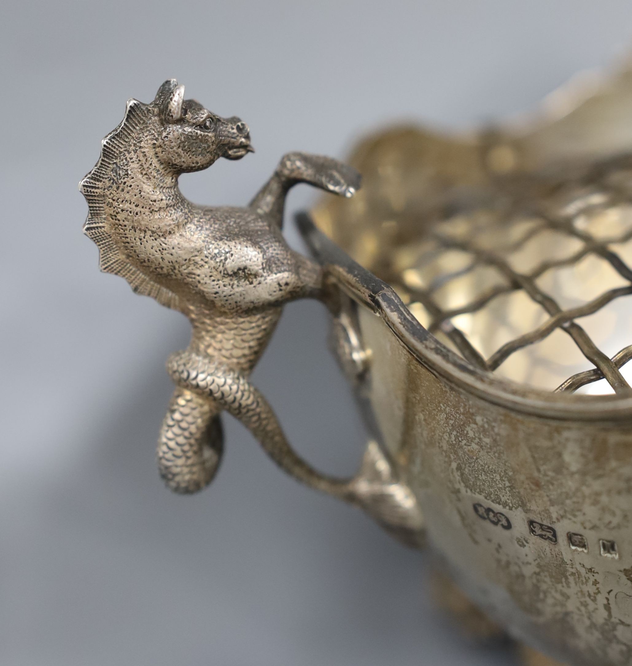 An ornate George V silver two handled oval rose bowl with sea horse handles and dolphin feet, Reid & Sons, London, 1926, 24cm over handles, 15oz.